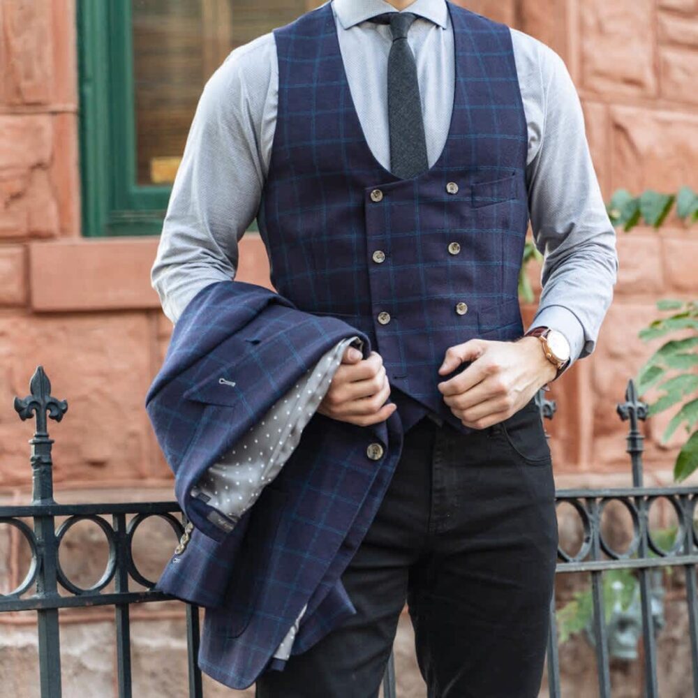 man in blue vest and blue dress shirt